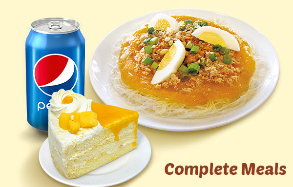 Plate of palobok, a slice of Red Ribbon Mango Supreme cake and a can of Pepsi.