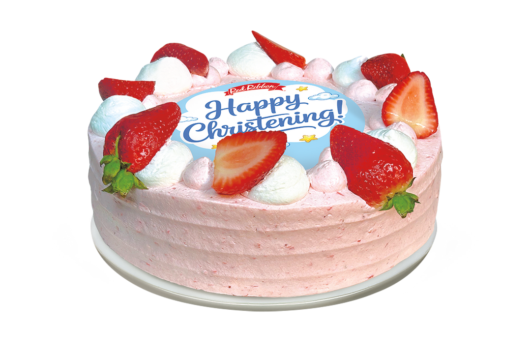 A round cake with light pink frosting and a decorative border of alternating white and pink whipped cream dollops, fresh strawberry halves, and whole strawberries. The center features a circular light blue topper displaying the Red Ribbon logo, the message "Happy Christening!" in blue script, and illustrations of small clouds and stars.