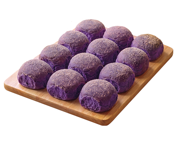 Twelve purple ube bread rolls dusted with sugar, arranged on a rectangular wooden board against a solid white background.